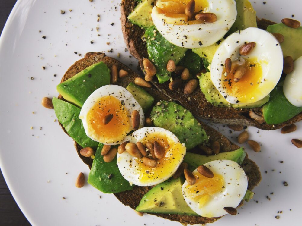 toast with soft boiled eggs, avocado and seeds