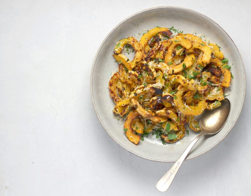 plate of cooked and slied delicata squash