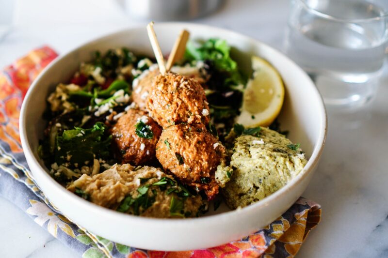 Mediterranean bowls with meatballs, greens, and hummus