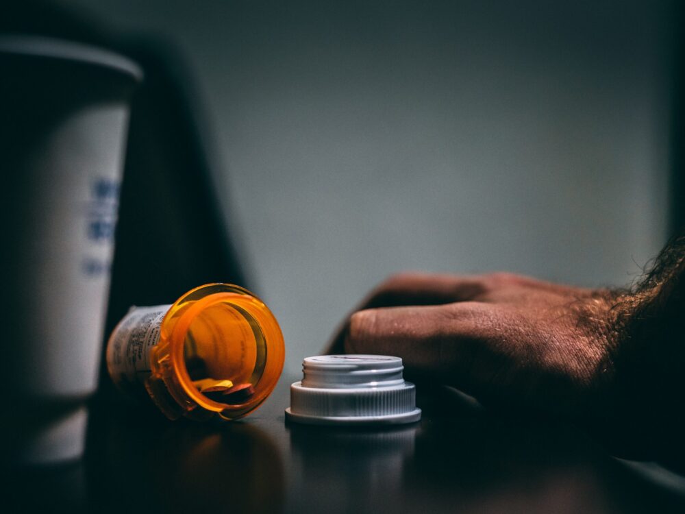 Orange and White Prescription Bottle On Table