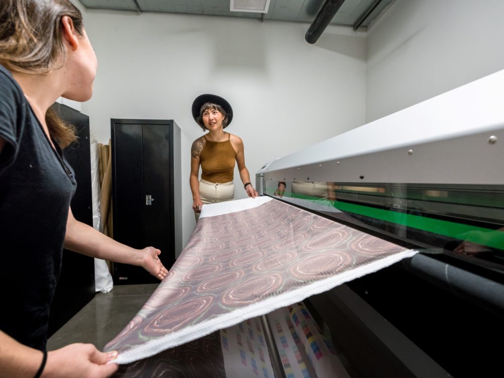 Students using a fabric printer