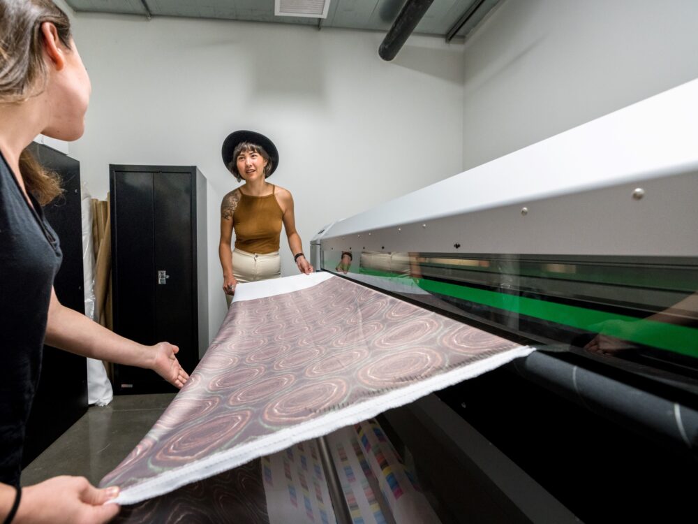 Students using a fabric printer