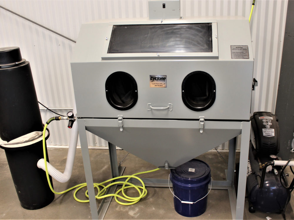 A sandblaster located in the Wood Lab