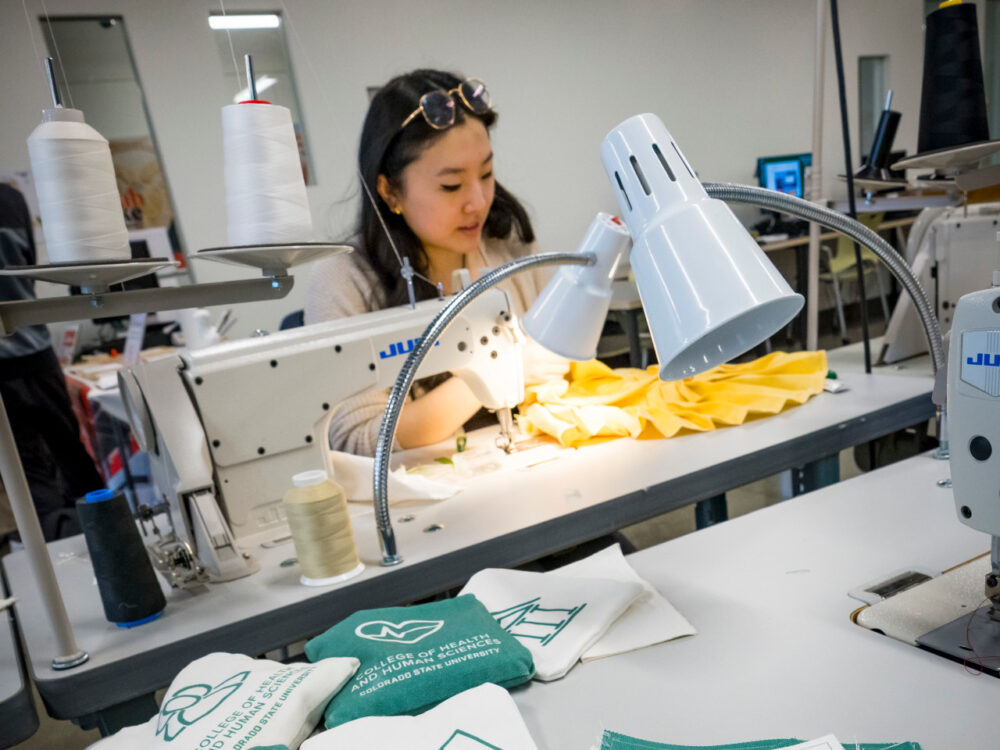 A student intern uses a sewing machine in the Prototype Lab to create beanbags for another CSU department