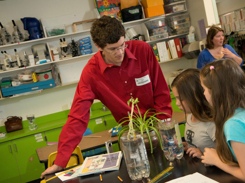 Student teacher teaches a science lesson in elementary classroom