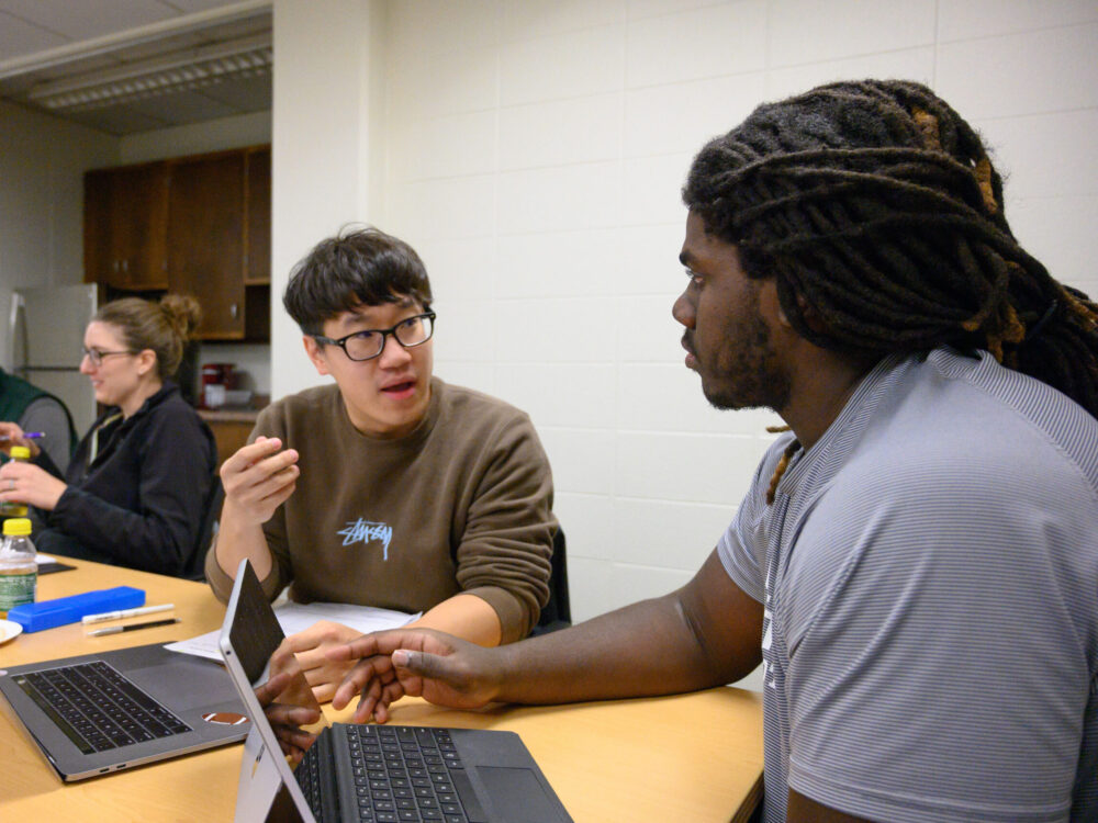 Two students have a discussion in Jill Zarestsky's graduate level adult education class.