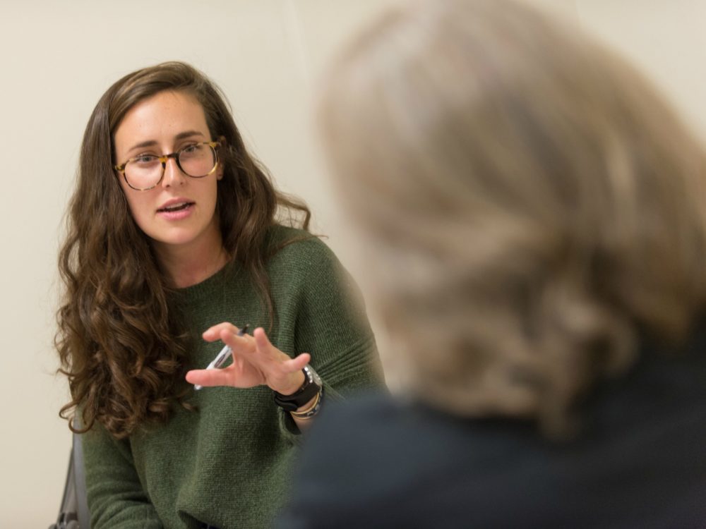 student talking with teacher