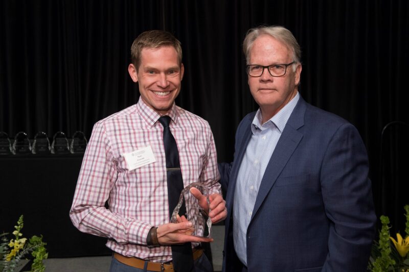 Ryan Donovan accepting award with Dean Jeff McCubbin
