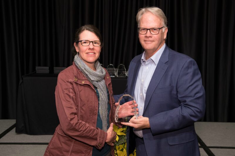 Jennifer Garvey accepting award with Dean Jeff McCubbin