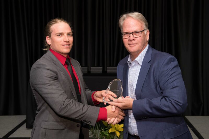 Addison Huck accepting award with Dean Jeff McCubbin