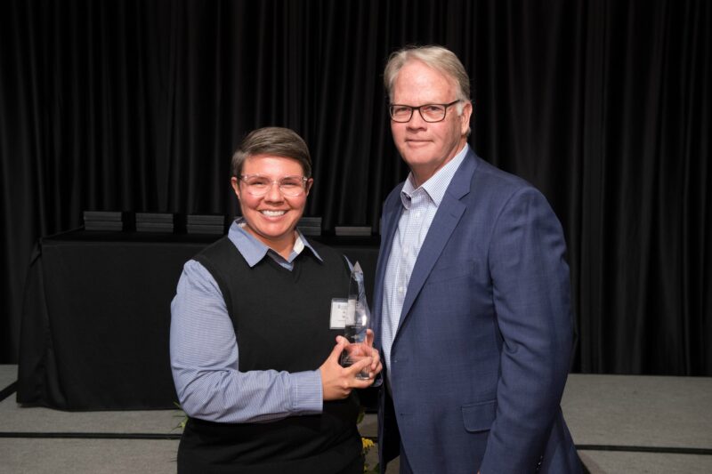 Ria Vigil accepting award with Dean Jeff McCubbin