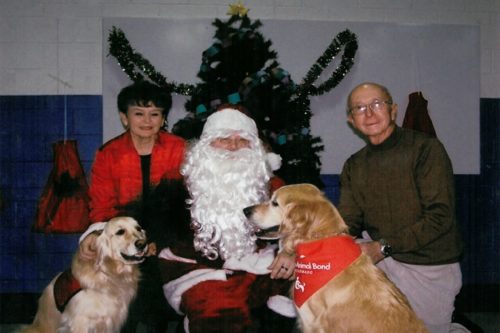Ben and Georgia Granger with Santa Claus and their dogs
