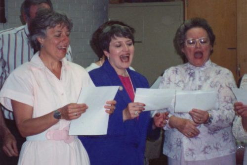 Louise Wendt White singing with colleagues