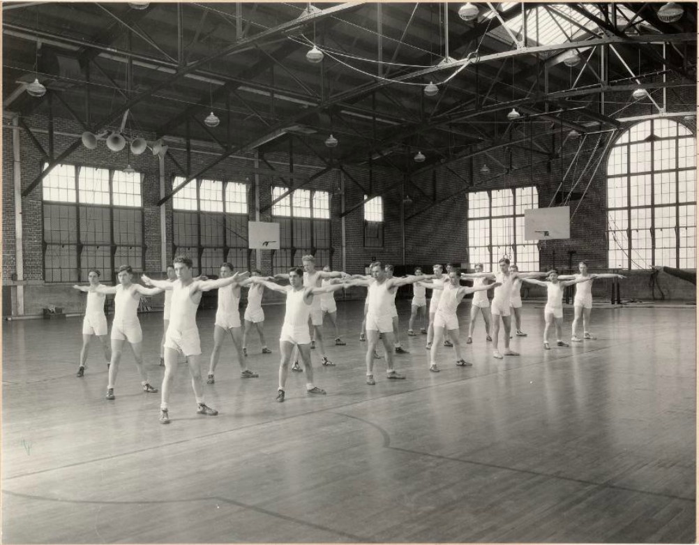 men exercising in rows inside the gym