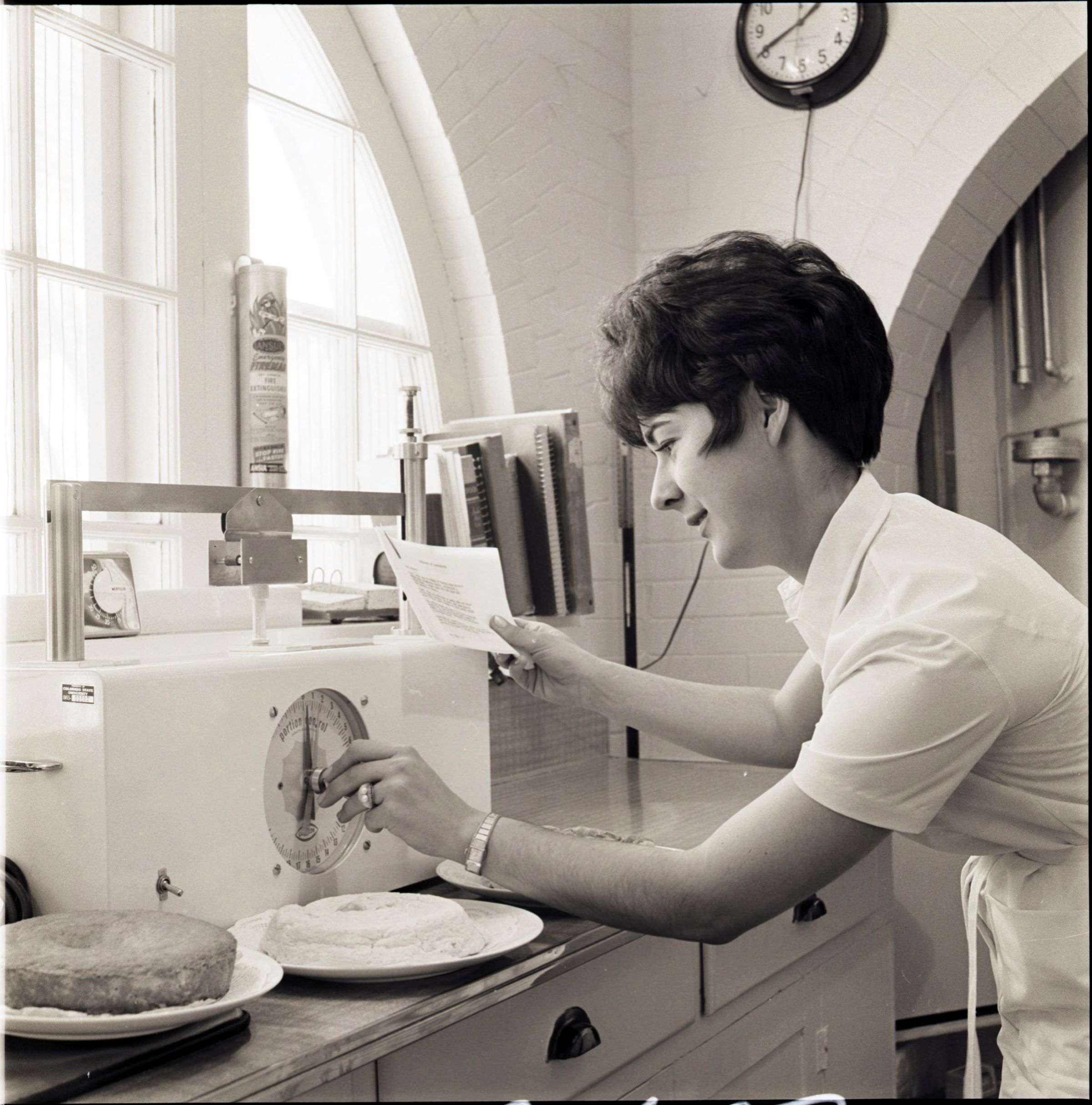 Woman baking in the High Altitude Lab.