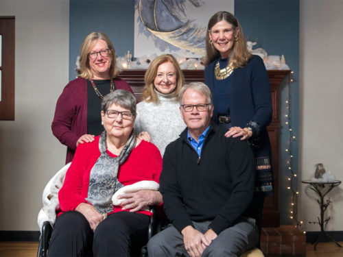 April Mason with Lise Youngblade, Jeff McCubbin, Nancy Harley, and Ellie Gilfoyle in a winter-themed living room.
