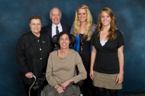 Kelly with her parents and two scholarship recipients