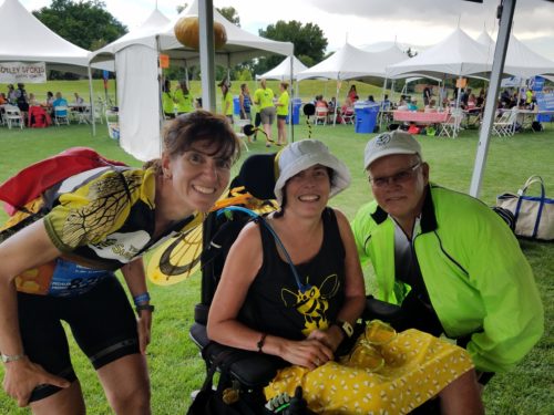 Gretchen Gerding and former dean Jeff McCubbin with Kelly at the M.S. ride tent for Team Sugar Bee