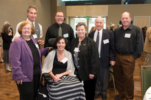 Kelly posing with her family at a scholarship event with CSU faculty and staff