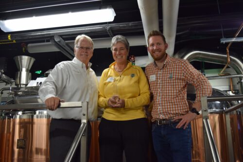 Jeff McCubbin with donors in the Ramskeller teaching brewery