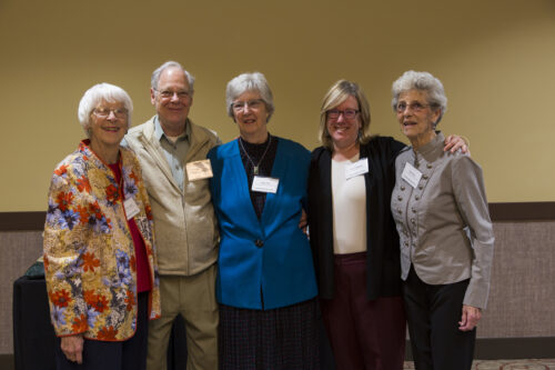 Barbara McCornack, George Morgan, Janet Fritz, Lise Youngblade, and Marie Macy standing together at an event