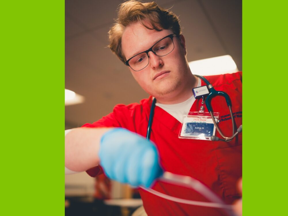An image of a CSU Pueblo nursing student working with a patient.