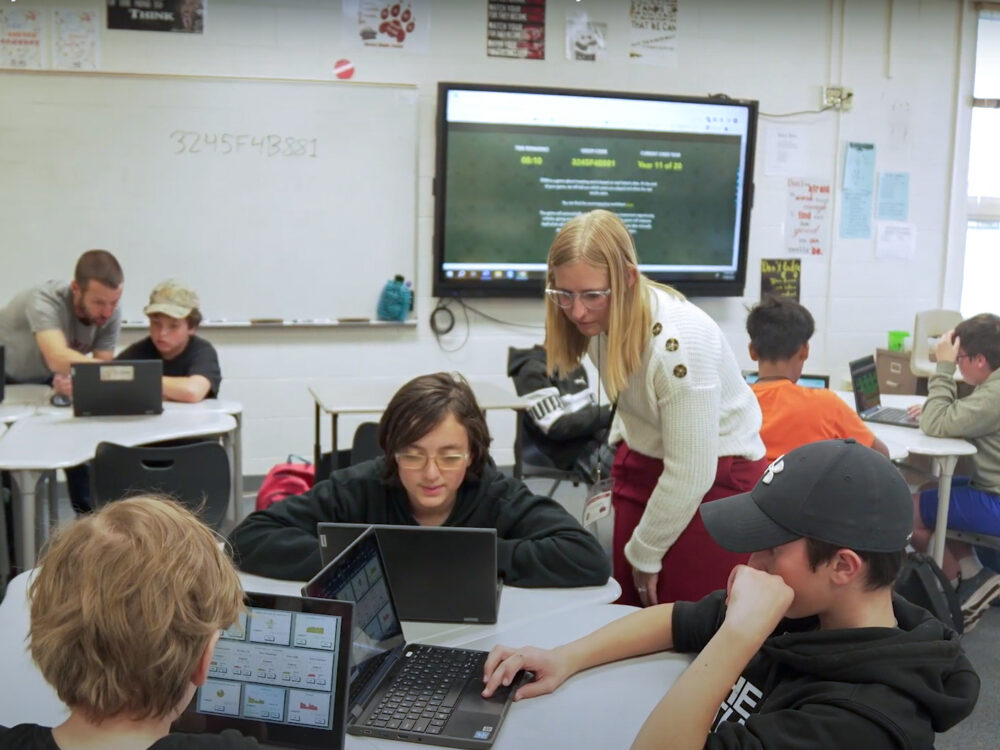 A CSU student teaches a classroom of middle schoolers.