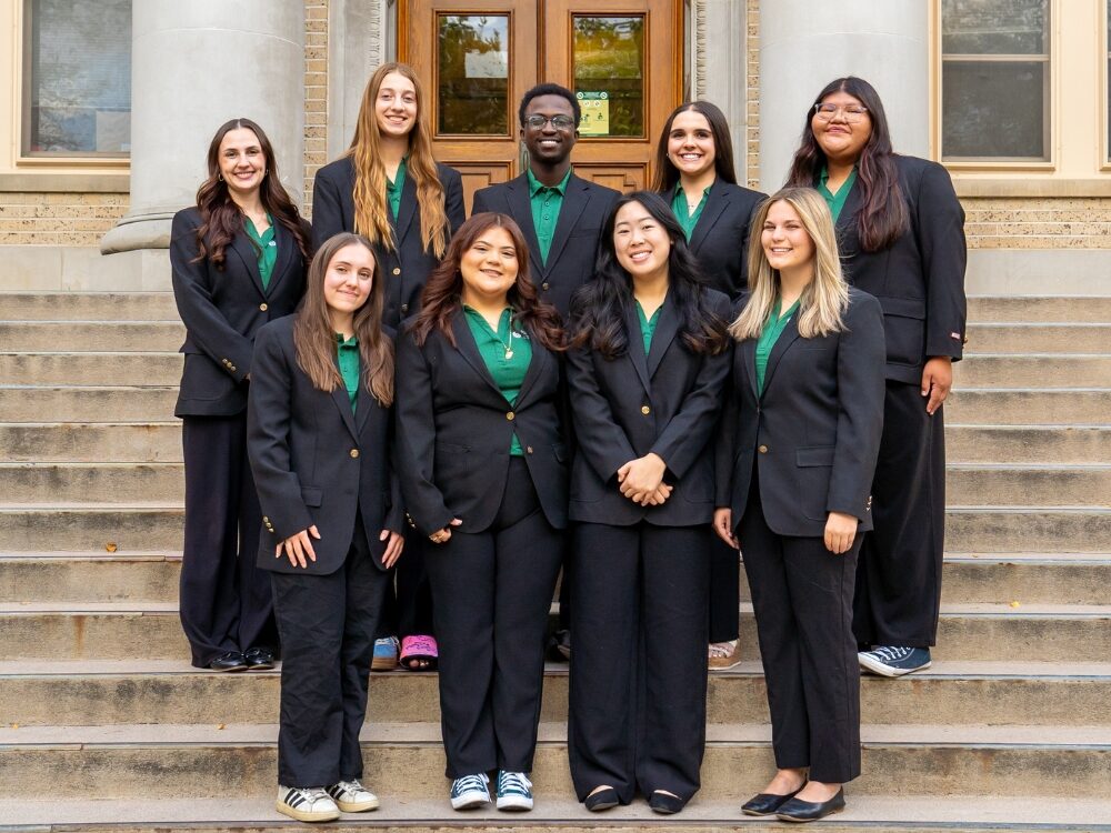 The Dean's Ambassador Program members smile while on the stairs of the CSU Administration Building